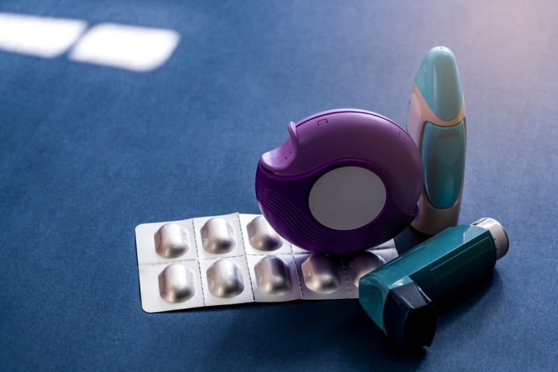 Medications for asthma on table.