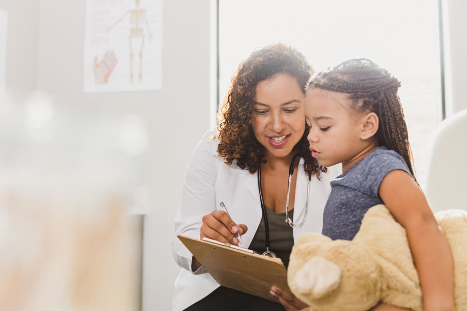 African American child with doctor