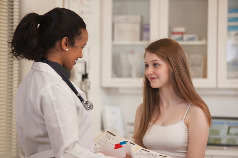 Teenager talking to doctor
