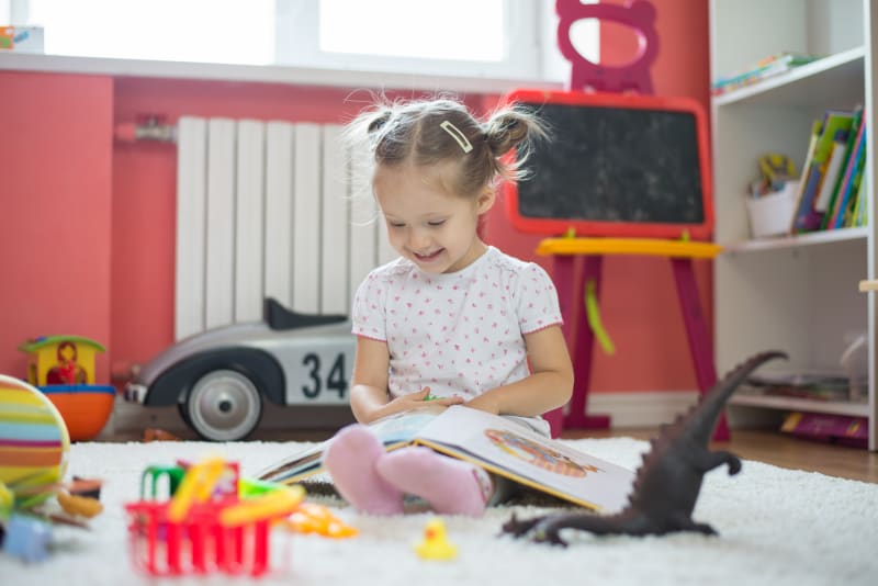Child playing with toys at home