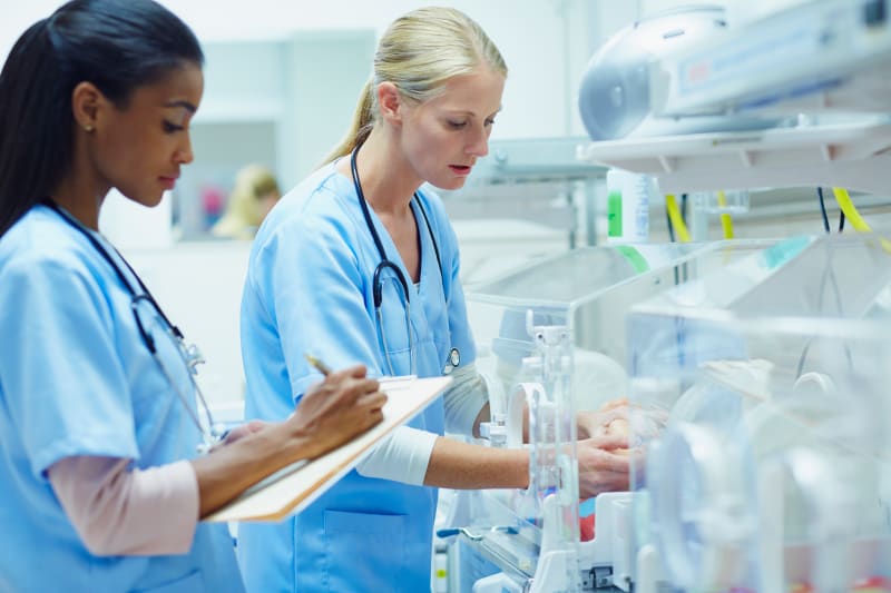 Health care providers working in the Neonatal Intensive Care Unit.